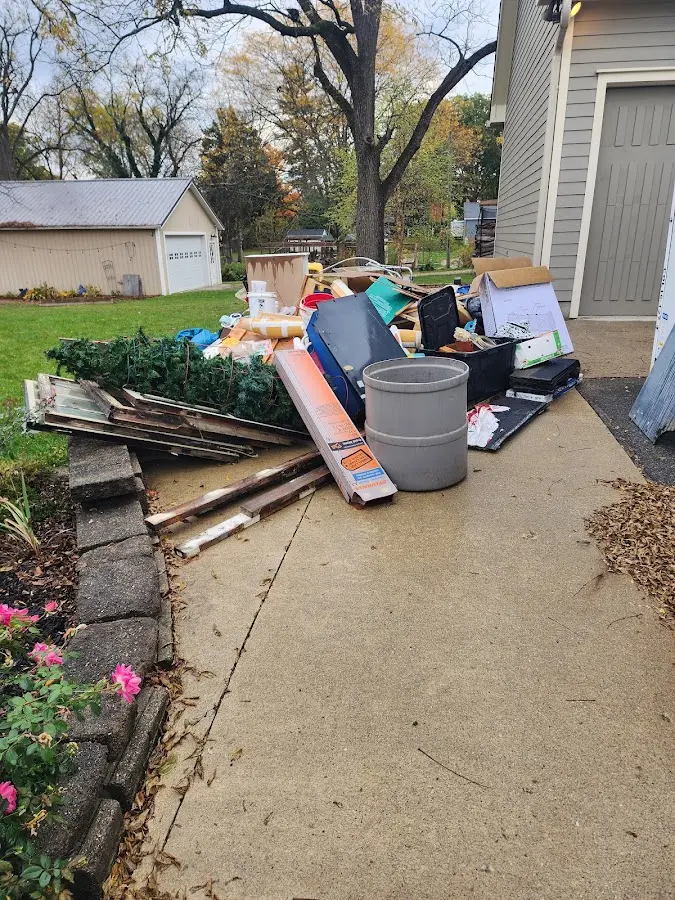 Dumpster being loaded with debris for Roofing Dumpster Rental in Fountain Hill